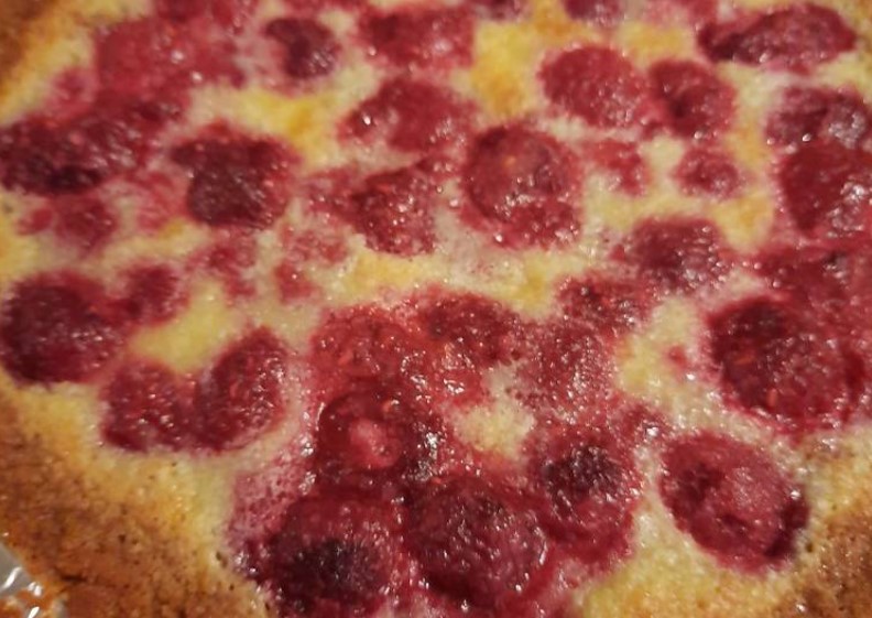 Raspberry custard tart in a cookie crumb crust